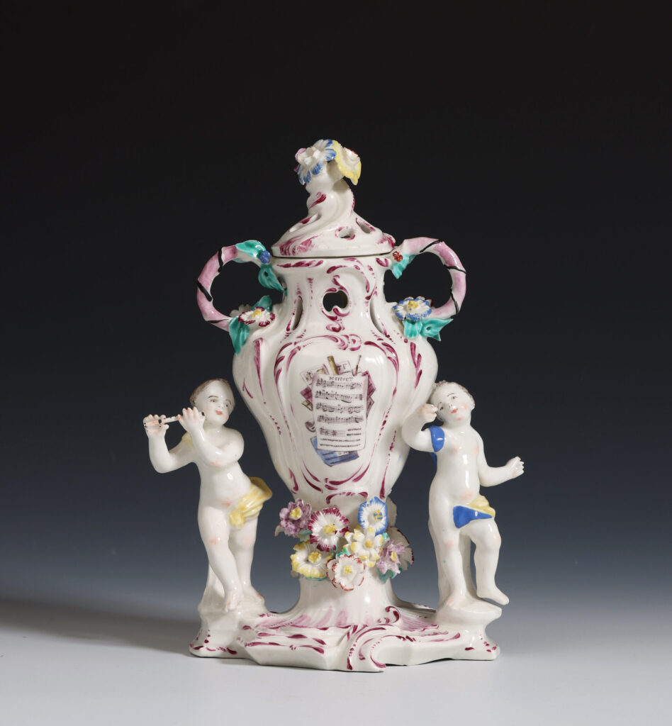 A BOW VASE AND COVER