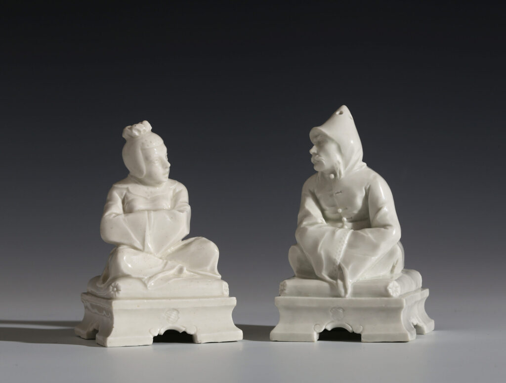 PAIR OF NYMPHENBURG PORCELAIN SEATED TARTARS