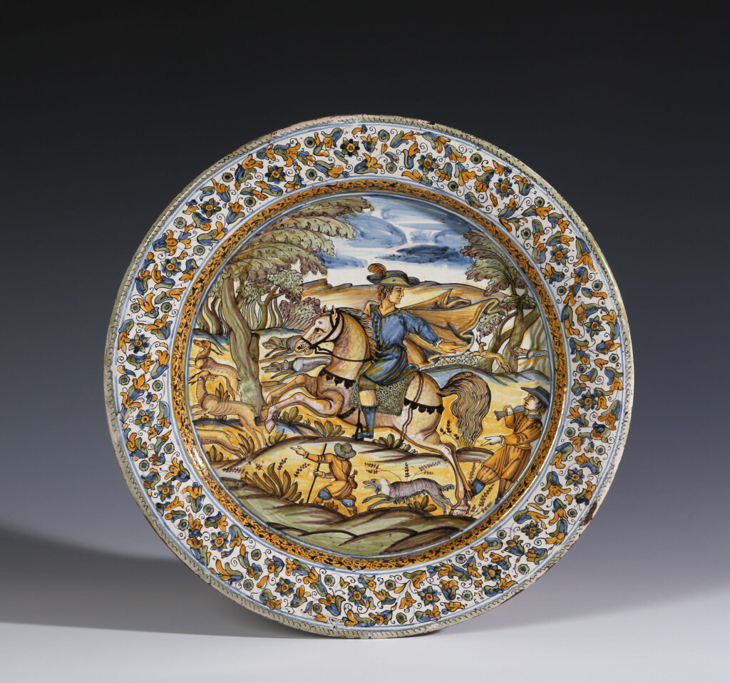 MAIOLICA DISH WITH HUNTSMAN RIDING TO HOUNDS