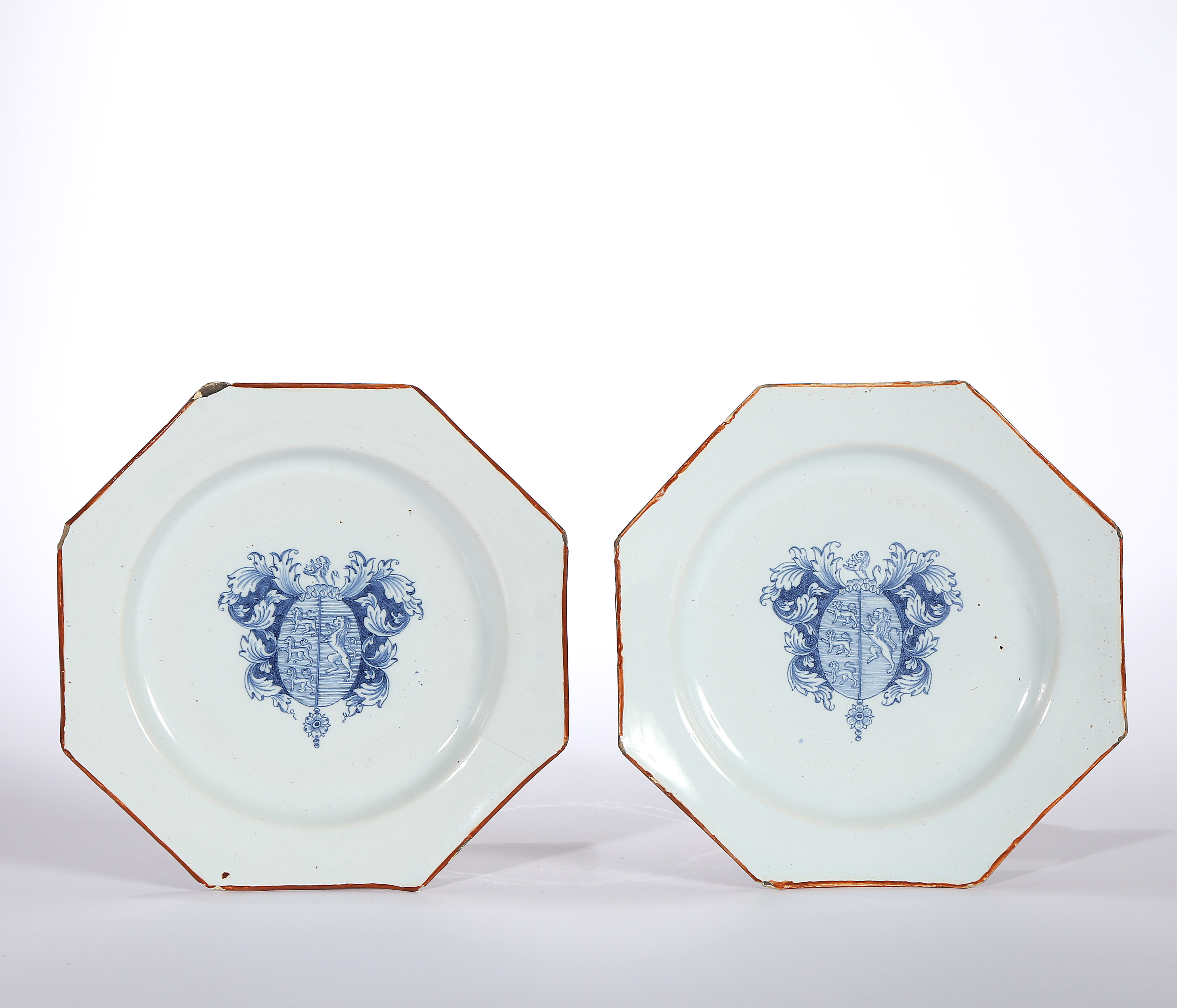 A PAIR OF ENGLISH OR IRISH ARMORIAL DELFT PLATES