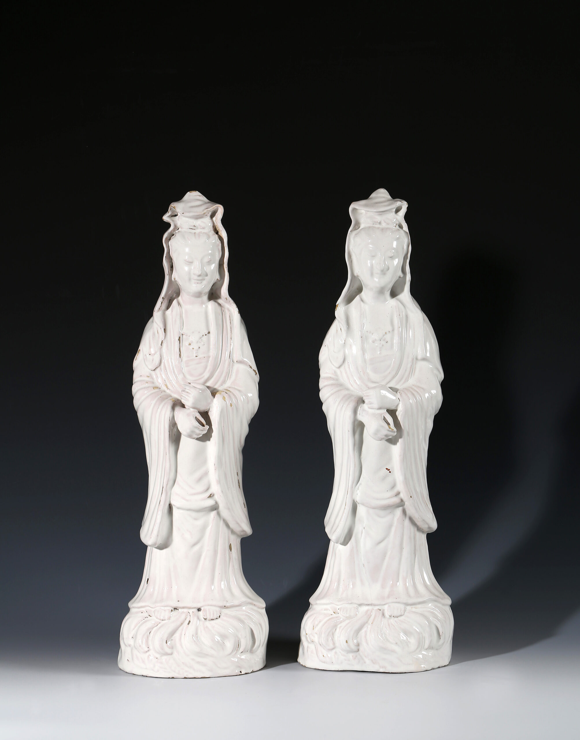 TWO GERMAN FAIENCE FIGURES OF GUANYIN