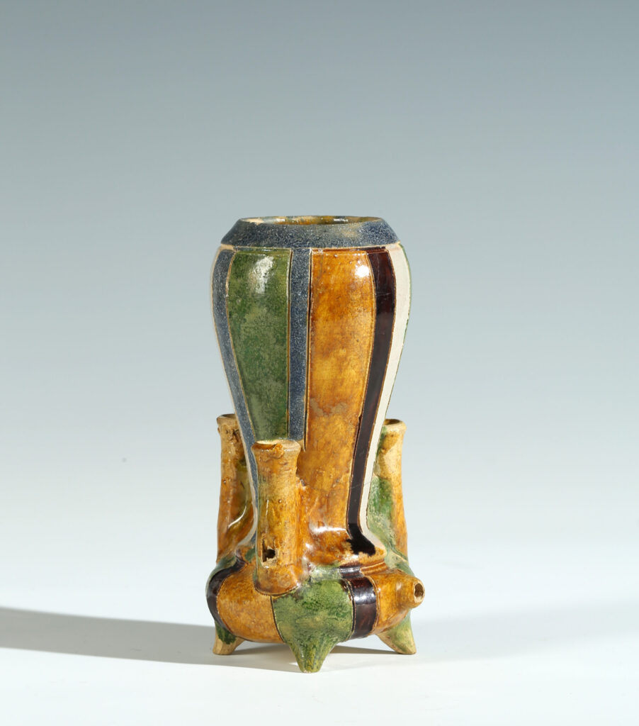 A HAFNER WARE VESSEL WITH THREE WHISTLES