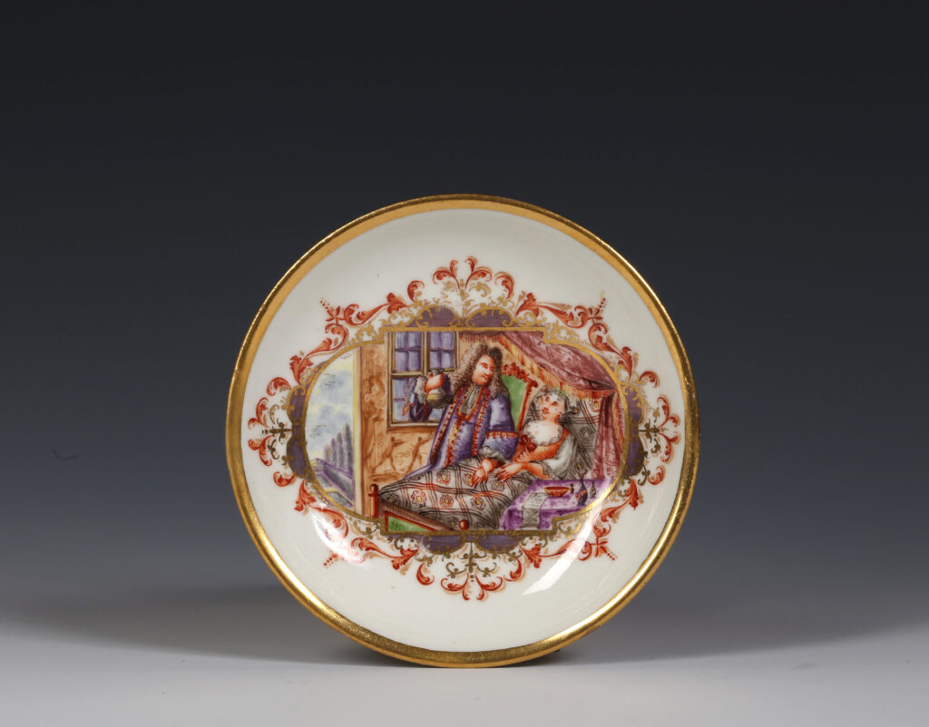 A MEISSEN SAUCER WITH A BEDSIDE SCENE