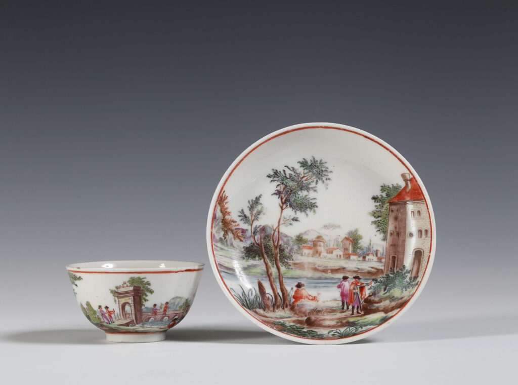 AN ITALIAN TEABOWL AND SAUCER