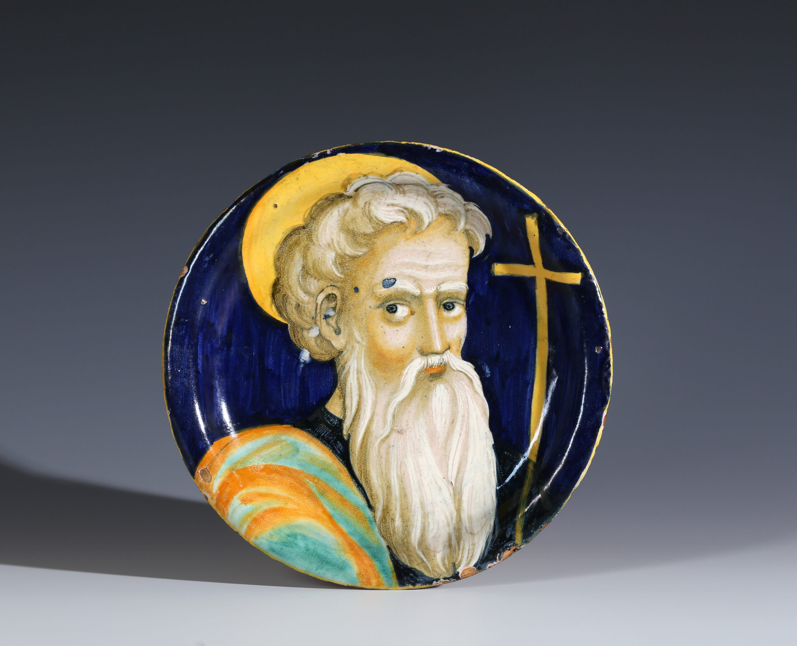 A MAIOLICA DISH WITH A PORTRAIT OF A SAINT