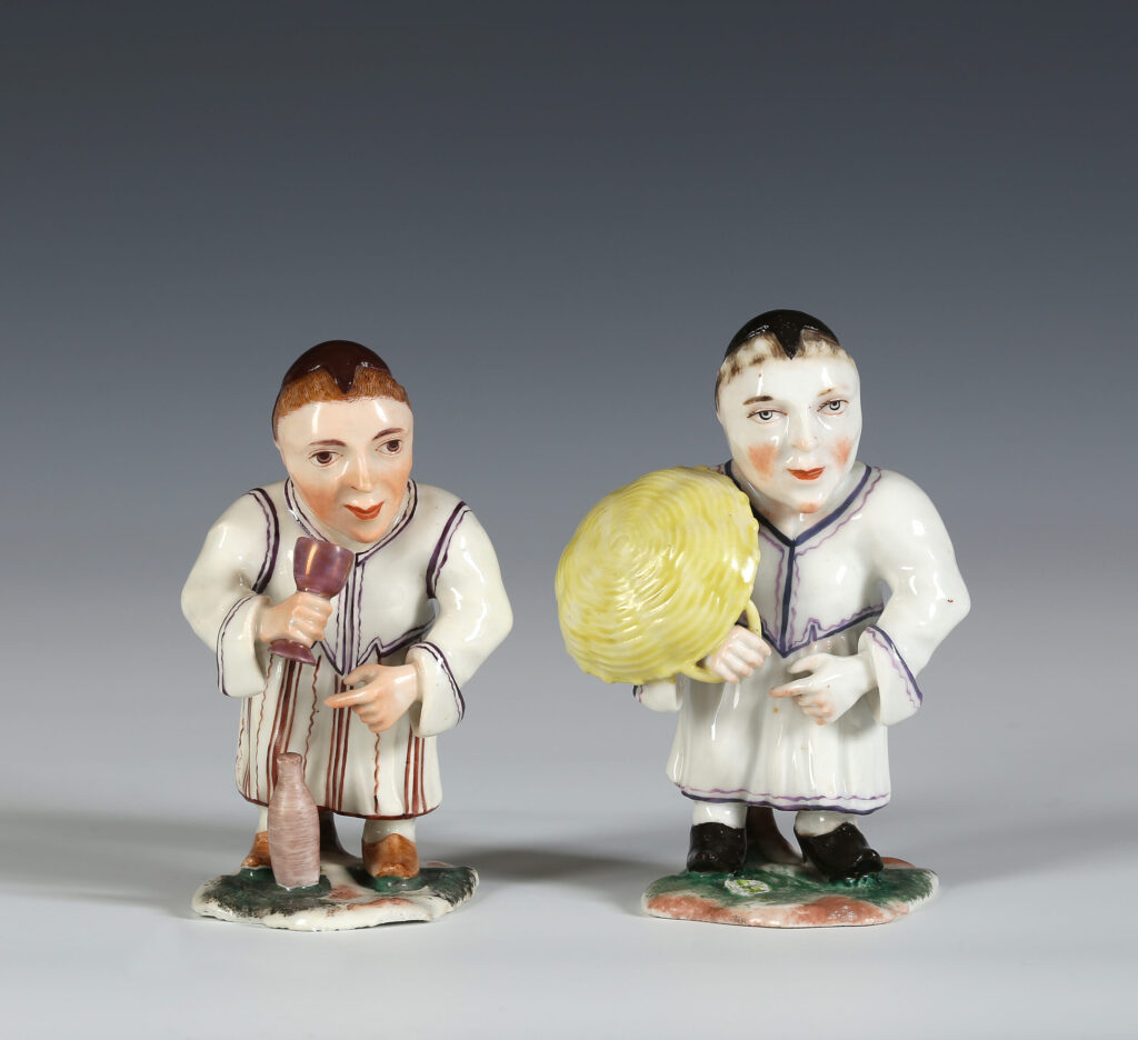 A PAIR OF STRASBOURG PORCELAIN FIGURES OF DWARFS