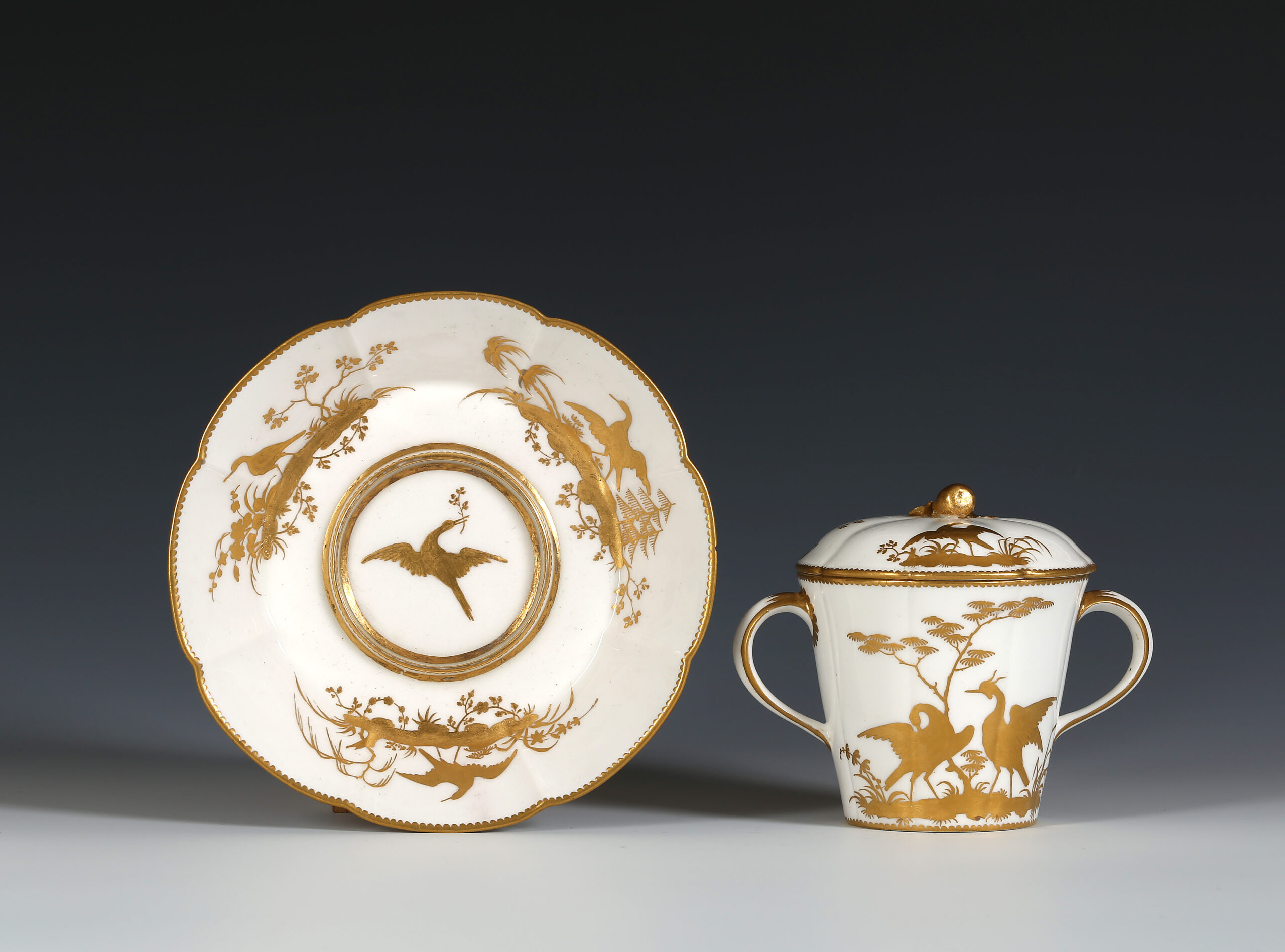 A VINCENNES TWO-HANDLED COVERED CUP AND SAUCER