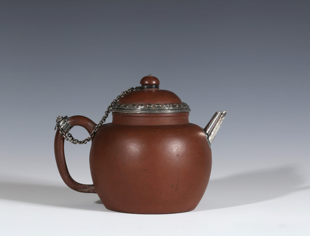 AN EARLY SILVER-MOUNTED YIXING TEAPOT