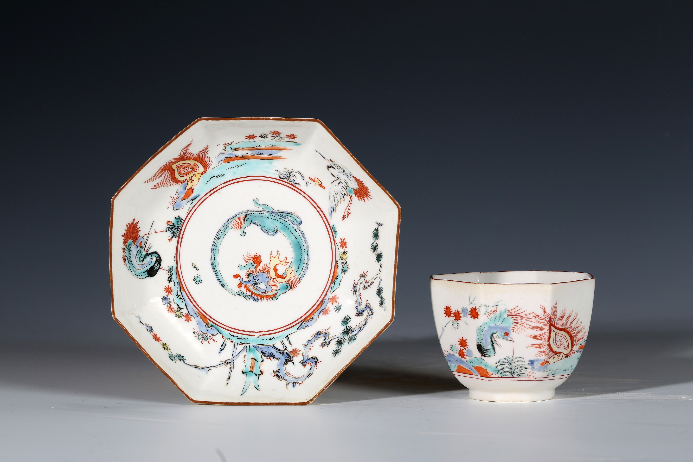 Chelsea Kakiemon Octagonal Teabowl and Saucer, With a Dragon and Flaming Tortoise