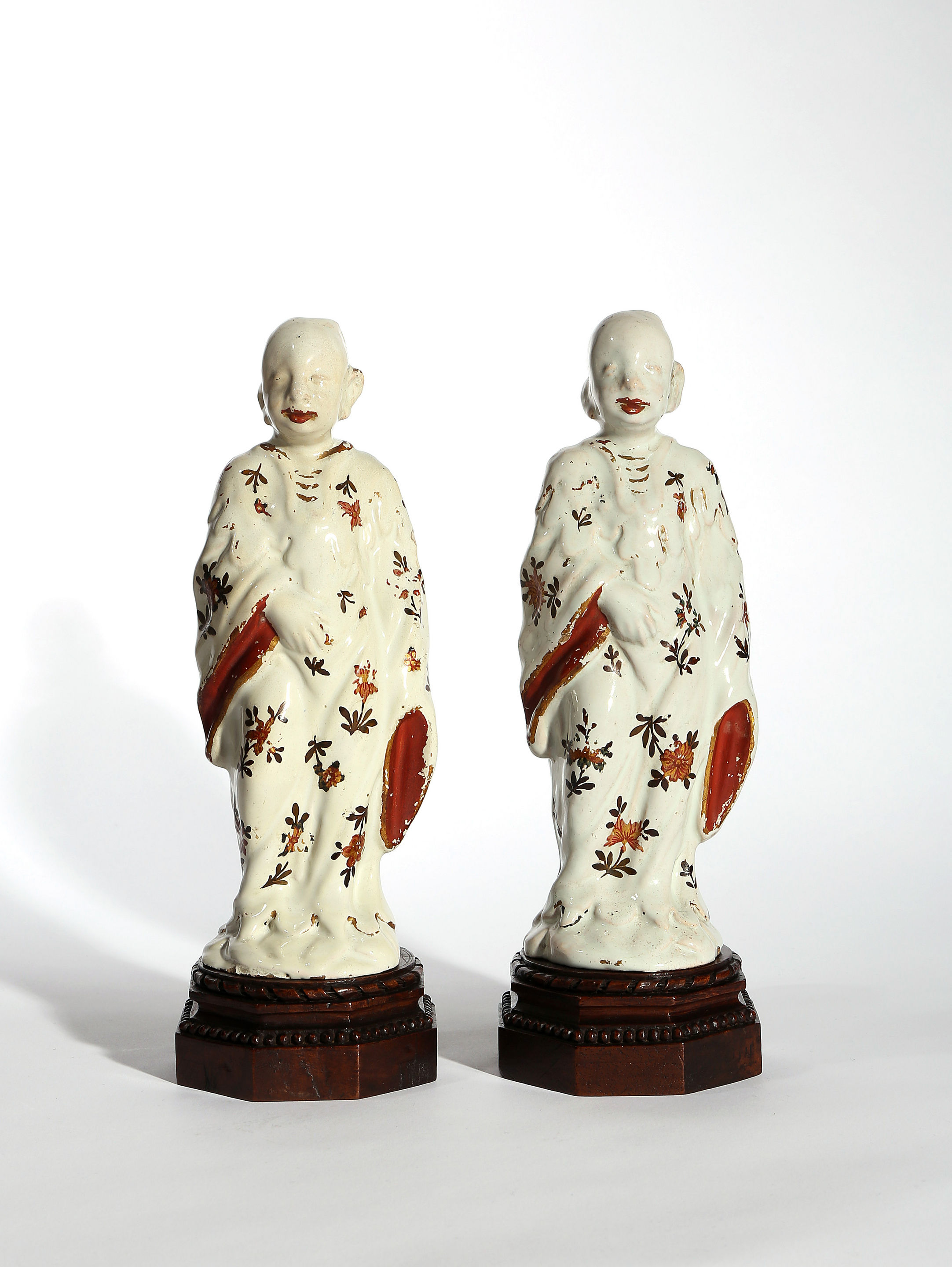 Two Milan Faience Figures of Chinamen on Wooden Stands, Factory of Felice Clerici