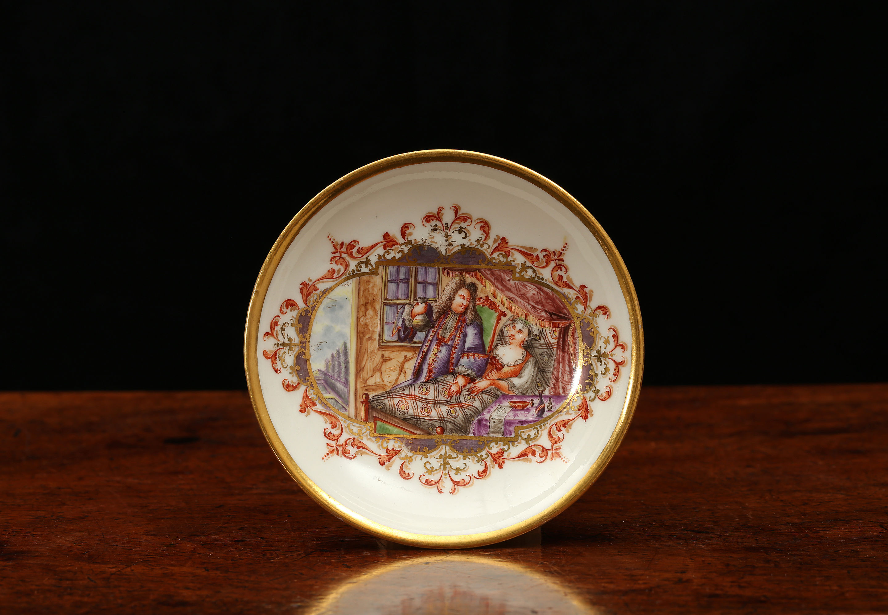 A MEISSEN SAUCER WITH A BEDSIDE SCENE, Probably painted by Johann Gregorius Höroldt