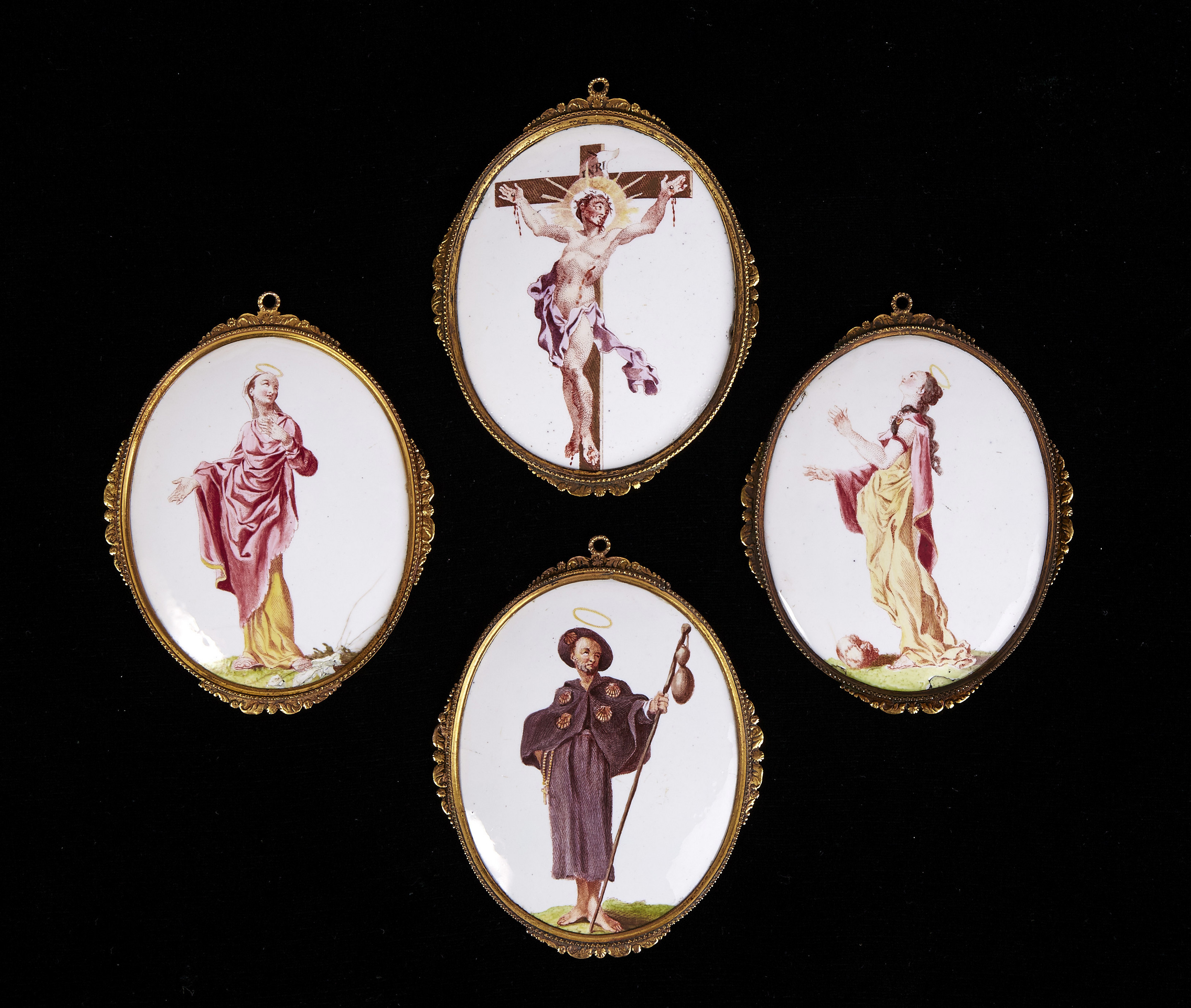 A Group of Four Battersea Enamel Oval Religious Plaques